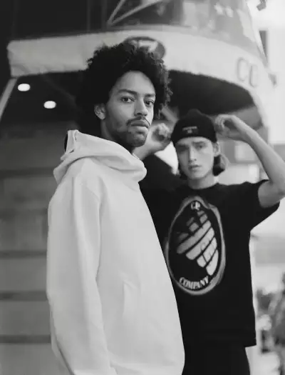 EMPORIO ARMANI / CP COMPANY White diagonal fleece hoodie, £253, navy blue Jersey graphic T-shirt, £90, cotton knit beanie, £97 EMPORIO ARMANI / CP COMPANY White diagonal fleece hoodie, £253, navy blue Jersey graphic T-shirt, £90, cotton knit beanie, £97