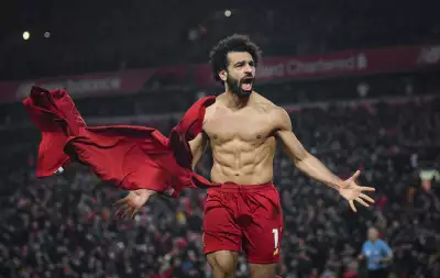 Mohamed Salah of Liverpool celebrates his goal to make it 2-0 during the Premier League match between Liverpool FC and Manchester United at Anfield on January 19, 2020 in Liverpool, United Kingdom.