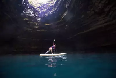Paddleboarding in a hot springs cave