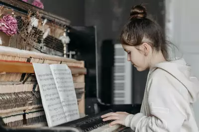 Young girl learning piano Young girl learning piano