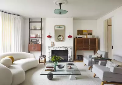 Irish designer Bryan O'Sullivan dresses a striking marble surround with eclectic objets d'art, bringing this living room up to date Irish designer Bryan O'Sullivan dresses a striking marble surround with eclectic objets d'art, bringing this living room up to date