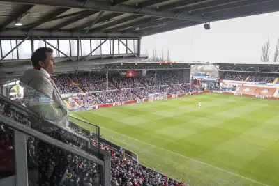 Rob McElhenney watches a match from the Betty Buzz Suite
