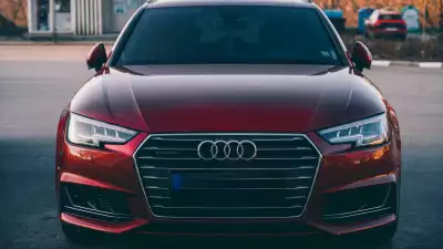 Front view of a red Audi A4 in a parking lot