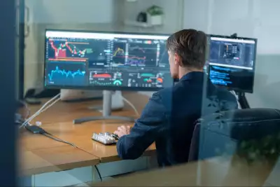 Man at trading desk Man at trading desk