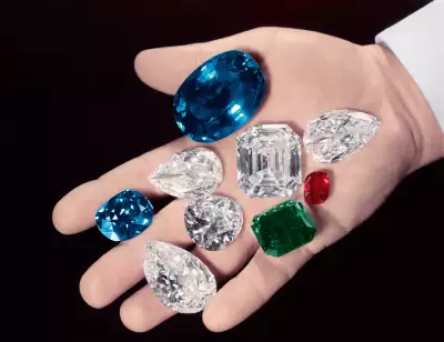 Mr Harry Winston's hand holding some of his most famous diamonds and gemstones Mr Harry Winston's hand holding some of his most famous diamonds and gemstones