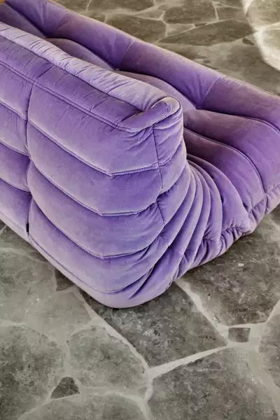 PURPLE REIGN: bold colour and softness contrast beautifully with concrete and stone, evidenced here by Ligne Roset.