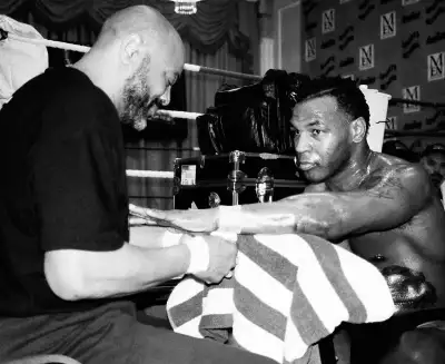 Mike Tyson, January 2000: Tyson being hand-wrapped at the Grosvenor House Hotel during training for his fight with Julius Francis. Mike Tyson, January 2000: Tyson being hand-wrapped at the Grosvenor House Hotel during training for his fight with Julius Francis.