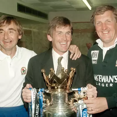 Dalglish celebrates with Ray Harford and Tony Parkes after Blackburn claim the 1995 Premier League