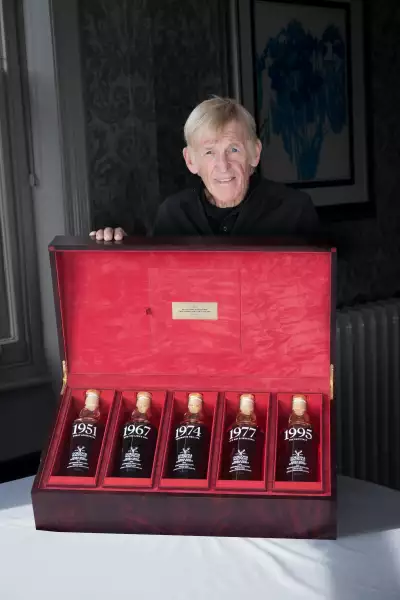 Sir Kenny Dalglish displaying the collection