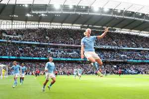 Erling Haaland of Manchester City celebrates after scoring his teams second goal during the Premier League match between Manchester City and Manchester United at Etihad Stadium on October 02, 2022 in Manchester, England.