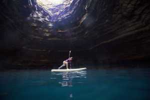 Paddleboarding in a hot springs cave