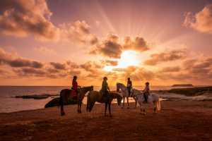 Horse riding on the beach at Cap St Georges