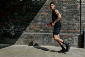 Model wearing Acid Running tank top