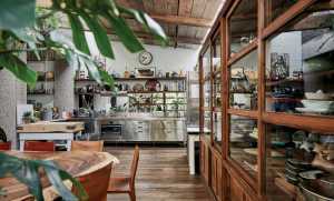 Antique cabinetry ensures more modern finishes feel harmonised in Ben Pentreath&rsquo;s contemporary take on a rustic kitchen.