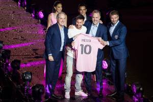 Argentine superstar Lionel Messi poses for a photo with Jorge Mas, one of the owners of Inter Miami, Former British football player and one of the owners of Inter Miami David Beckham, Jose R. Mas, one of the owners of Inter Miami, and his jersey during t