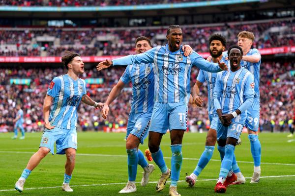 Coventry City's Haji Wright (centre) celebrates after scoring their side's third goal of the game from the penalty spot during the Emirates FA Cup semi-final match at Wembley Stadium.