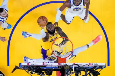 Los Angeles Lakers forward LeBron James, middle, shoots against Golden State Warriors forward Draymond Green during the first half of Game 5 of an NBA basketball second-round playoff series Wednesday, May 10, 2023, in San Francisco