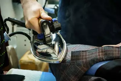 George of The Valet Pressing a Bespoke Jacket