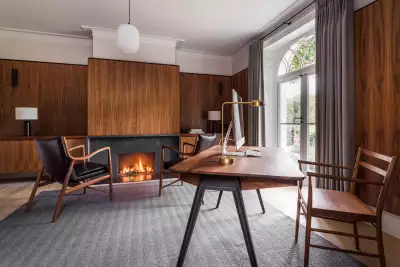 Gregory Phillips uses timber cladding on walls to keep the space feeling contemporary amid more traditional architecture.