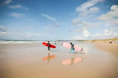 Surfers on a Cornish beach