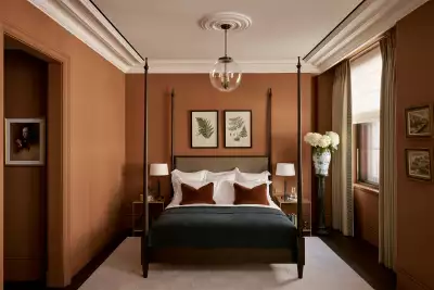 Albion Nord keeps colour choices contemporary, using clay tones from floor to cornice to warm up the bedroom at the OWO.