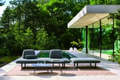 Patio power: Sofas with confident curves, textural rugs and landscaped tables bring softness to your garden scheme.