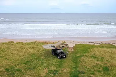 Land Rover Defender near a beach
