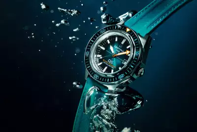 The Certina DS Super PH2000M Sea Turtle Conservancy Limited Edition watch, featuring a striking turquoise-fum&eacute; dial and a vibrant blue silicone strap captured mid-dive