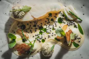 Turbot cooked on the bone with artichoke and mussel salsify and roe