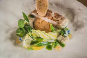 Wild seabass mussel courgette and sea greens