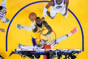 Los Angeles Lakers forward LeBron James, middle, shoots against Golden State Warriors forward Draymond Green during the first half of Game 5 of an NBA basketball second-round playoff series Wednesday, May 10, 2023, in San Francisco