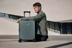 Man with Victorinox suitcase Man with Victorinox suitcase