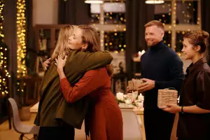 Family hugging at Christmas