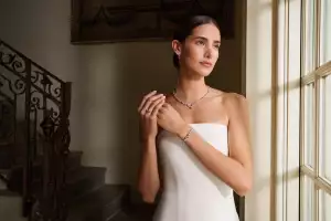 Model wears Harry Winston's latest Sparkling Cluster Collection suite.