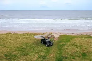 Land Rover Defender near a beach