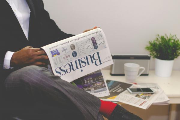 Man reading business newspaper