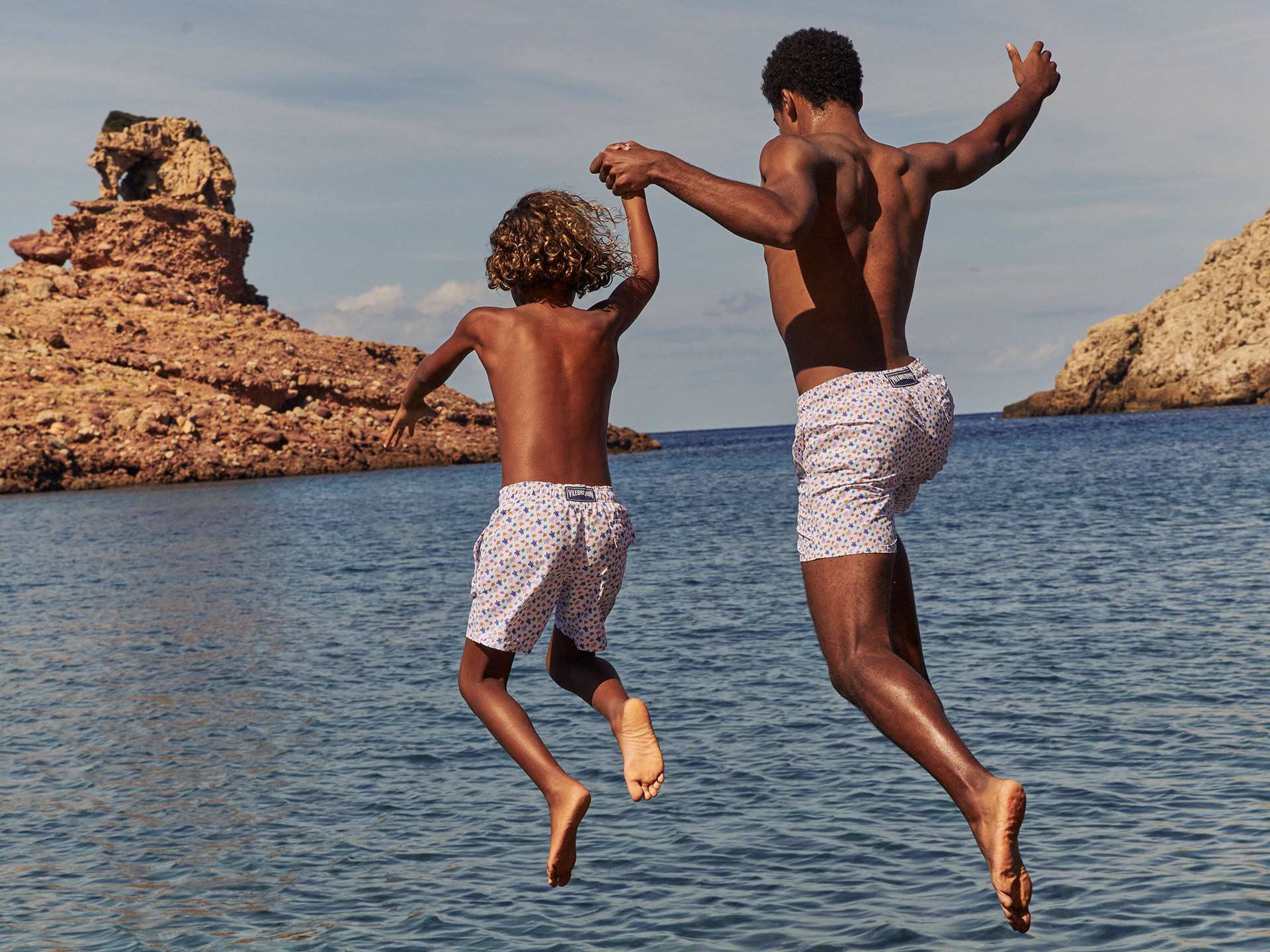 Vilebrequin ‘mini turtles’ swimming shorts, £250; Vilebrequin ‘mini turtles’ boys’ swimming shorts, £125, vilebrequin.com