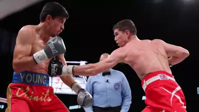 Luke Campbell in boxing match against Young action shot