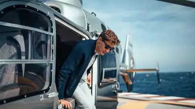 F1 driver George Russell in Monaco stepping out of a helicopter