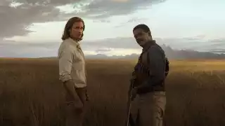 Alexander Skarsgard and Samuel L Jackson standing in a field in Tarzan