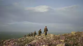 Kurdistan Workers’ Party (PKK) guerrillas on an armed patrol in the countryside of Makhmur