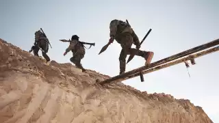 YPG fighters resupply RPG rounds to a frontline position