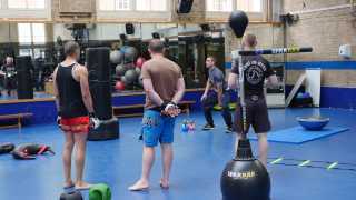 100% training MMA london interior shot with people