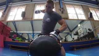 100% Gym MMA Training interior live shot with person working out