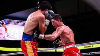 Luke Campbell in boxing match against Young action shot