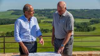 Massimo Ferragamo and Tom Weiskopf viewing development plans