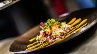 Grilled cornfed chicken with avocado purée, mix lettuce leaves and mango dressing