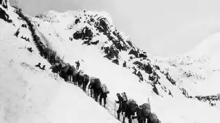 Gold-diggers in Alaska climbing up the Chilkoot pass on the way to Klondyke