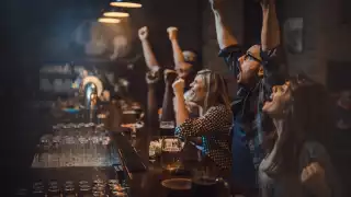 Punters enjoying sports at a bar