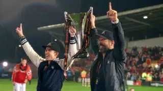 Rob McElhenney and Ryan Reynolds celebate with the National League trophy